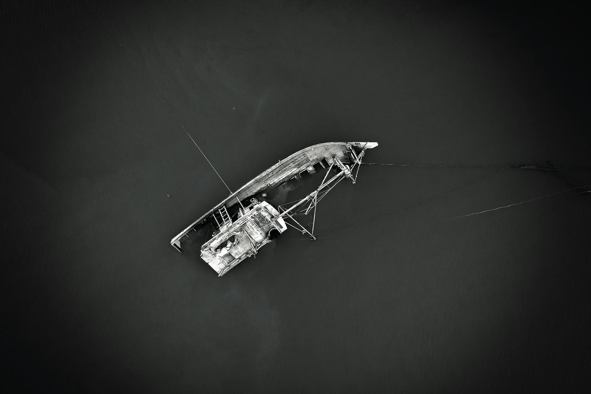 In this picture a derelict vessel is partially submerged. The messages in this category often concern possible loss of life from capsizing.