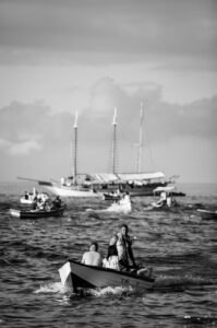 people riding boat on body of water