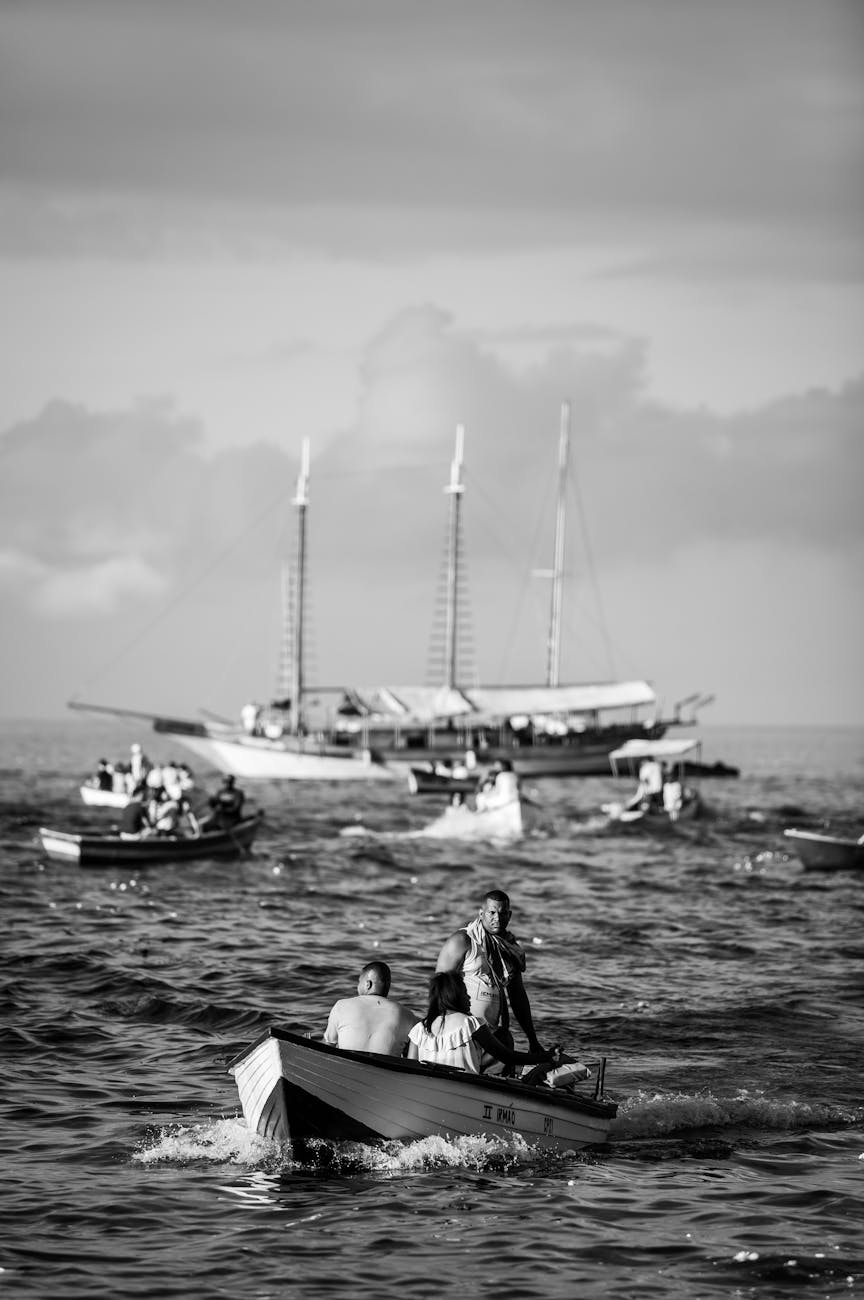 people riding boat on body of water