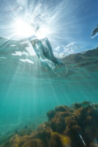 a face mask in the ocean