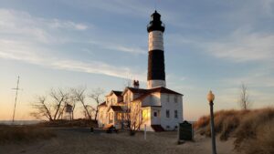 lighthouse on beach at dusk